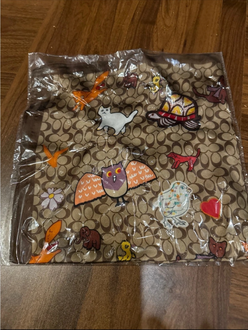 Coach Signature Canvas Tote with Colorful Animal Motifs on Tan